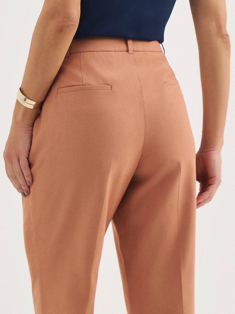 calcca cleide detalhe bolso costas